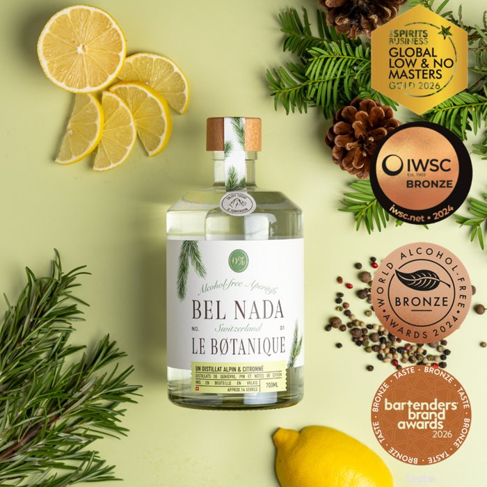 Bouteille Belnada Le Botanique entourée de citron et de pin